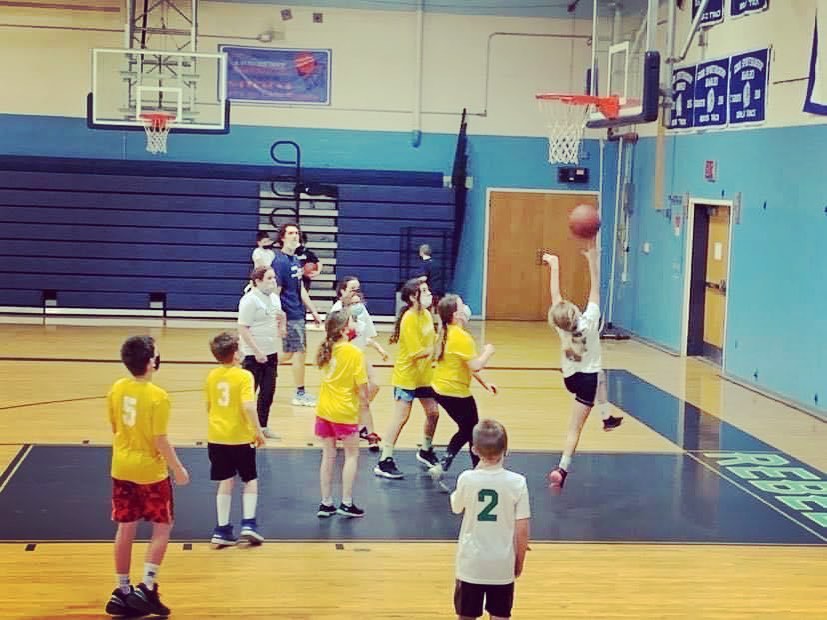 Children playing basketball in Bethel Rec